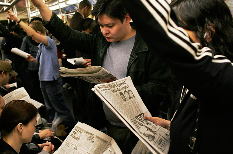 People reading newspapers